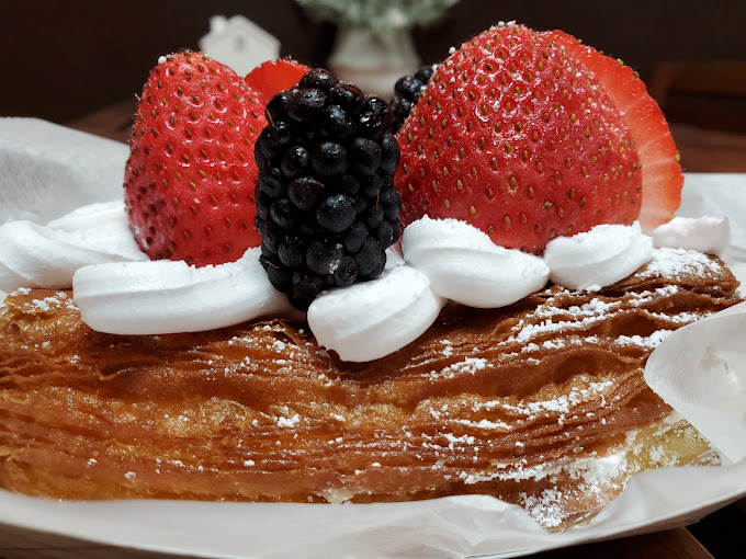 Gourmet donut with fresh strawberries and cream