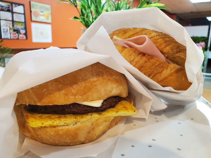 Freshly made breakfast sandwiches wrapped in paper