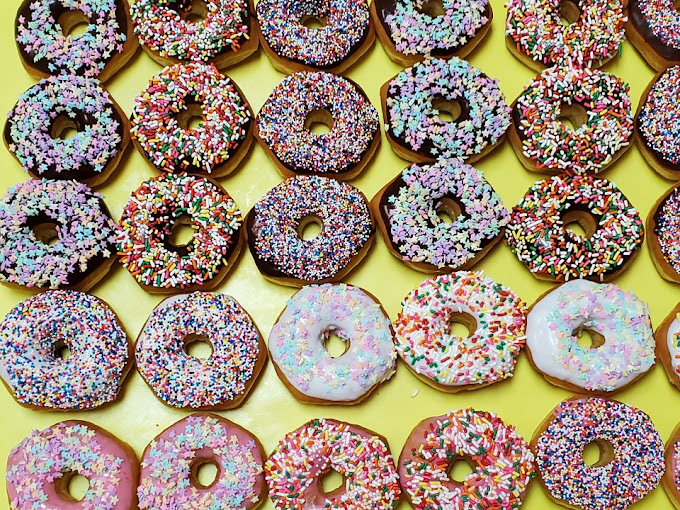 Colorful sprinkle-covered donuts